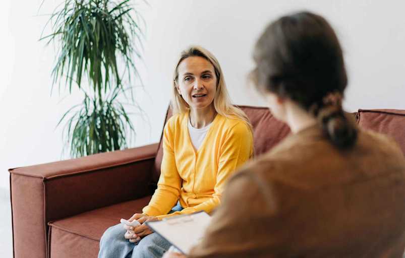 A Woman In A Consultation With A Counselor Listens To Advice On Improving Behavior In Life.