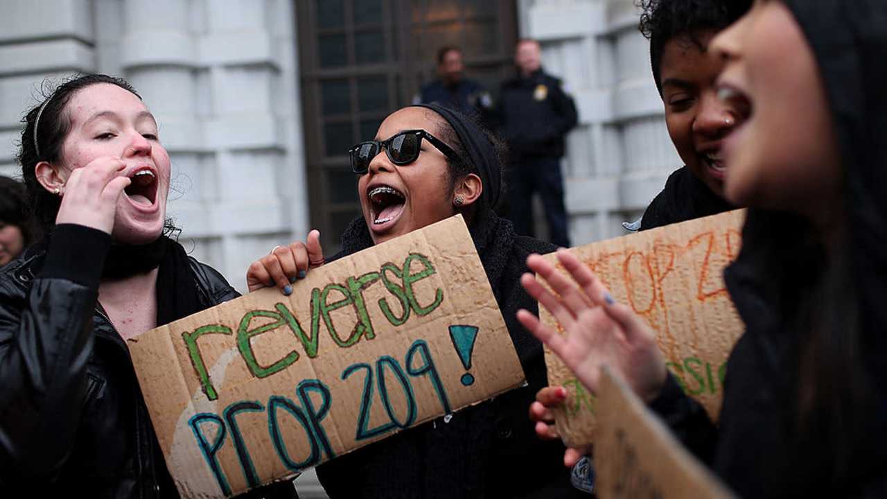 SAN FRANCISCO, CA - FEBRUARY 13: Students hoping for a repeal of California's Proposition 209 hold signs as they protest outside of the Ninth U.S. Circuit Court of Appeals on February 13, 2012 in San Francisco, California. A Federal appeals court will hear arguments in a lawsuit that wants to overturn Proposition 209, a voter approved measure that prohibits affirmative action at state universities. (Photo by Justin Sullivan/Getty Images)