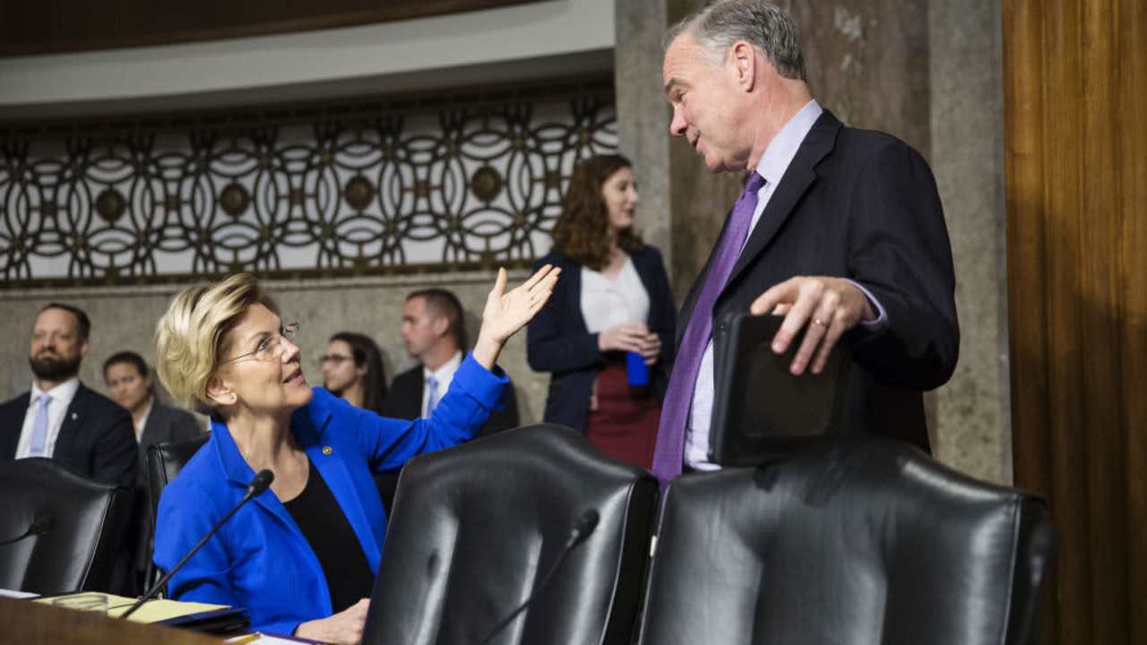 Senator Elizabeth Warren, a Democrat from Massachusetts, left, speaks with Senator Tim Kaine, a Democrat from Virginia, while arriving for a Senate Armed Services Committee confirmation hearing for Mark Esper, secretary of defense nominee for U.S. President Donald Trump, not pictured, on Capitol Hill in Washington, D.C., U.S., on Tuesday, July 16, 2019. Esper's confirmation as secretary of defense is a matter of urgency after almost seven months with an acting leader at the Pentagon, the top Republican and Democrat on the Senate Armed Services Committee said at the hearing. Photographer: Sarah Silbiger/Bloomberg via Getty Images