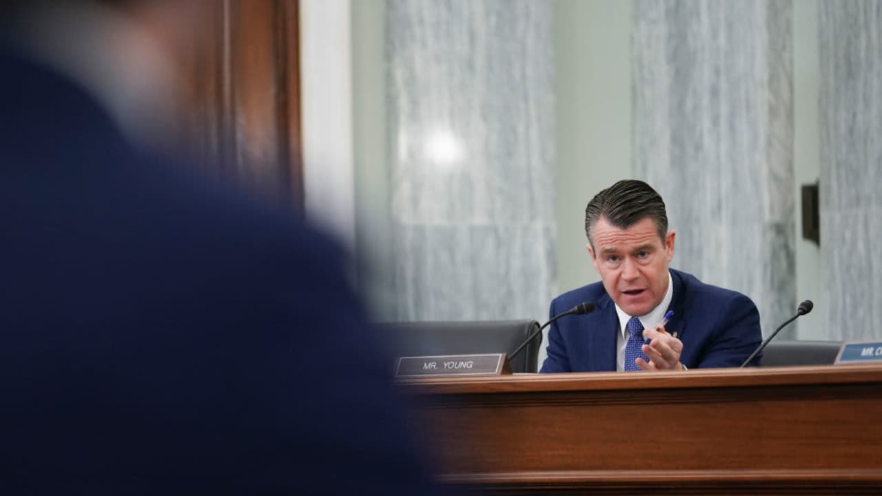 WASHINGTON, DC - JANUARY 21: Senator Todd Young, a Republican from Indiana, speaks as Pete Buttigieg, U.S. secretary of transportation nominee for U.S. President Joe Biden, left, listens during a Senate Commerce, Science and Transportation Committee confirmation hearing on January 21, 2021 in Washington, D.C. Buttigieg, is pledging to carry out the administration’s ambitious agenda to rebuild the nation’s infrastructure, calling it a “generational opportunity” to create new jobs, fight economic inequality and stem climate change.