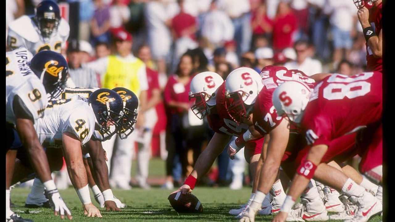 Cal vs Stanford football players before a play begins
