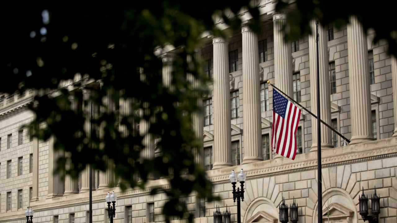 An American flag flies outside the U.S. Department of Commerce headquarters in Washington, D.C., U.S.