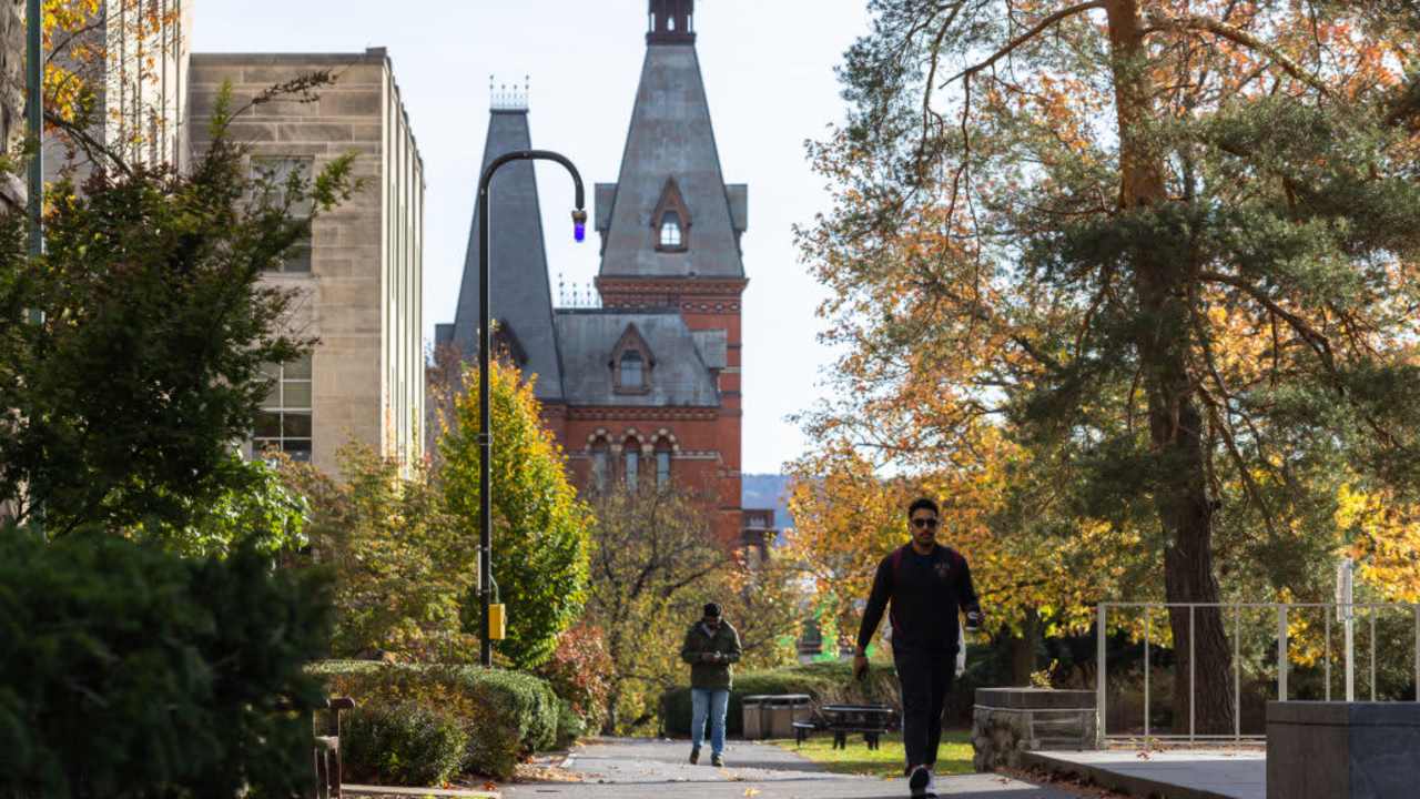 ITHACA, NEW YORK - NOVEMBER 3: People walk through the Cornell University campus on November 3, 2023 in Ithaca, New York. The university canceled classes after one of its students is accused of making violent antisemitic threats.
