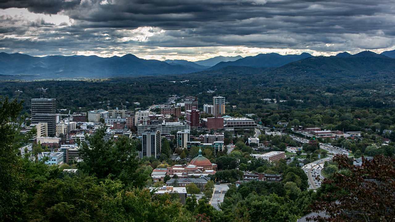 ASHEVILLE, NC - OCTOBER 6: The downtown area is undergoing a small building construction boom as viewed by the number skyline cranes on October 6, 2015 in Asheville, North Carolina. Named one of the "Top 10 Great Places to Retire" by AARP, Asheville is experiencing a minor cultural revolution, with the addition of new restaurants, live music, and a vibrant arts community.