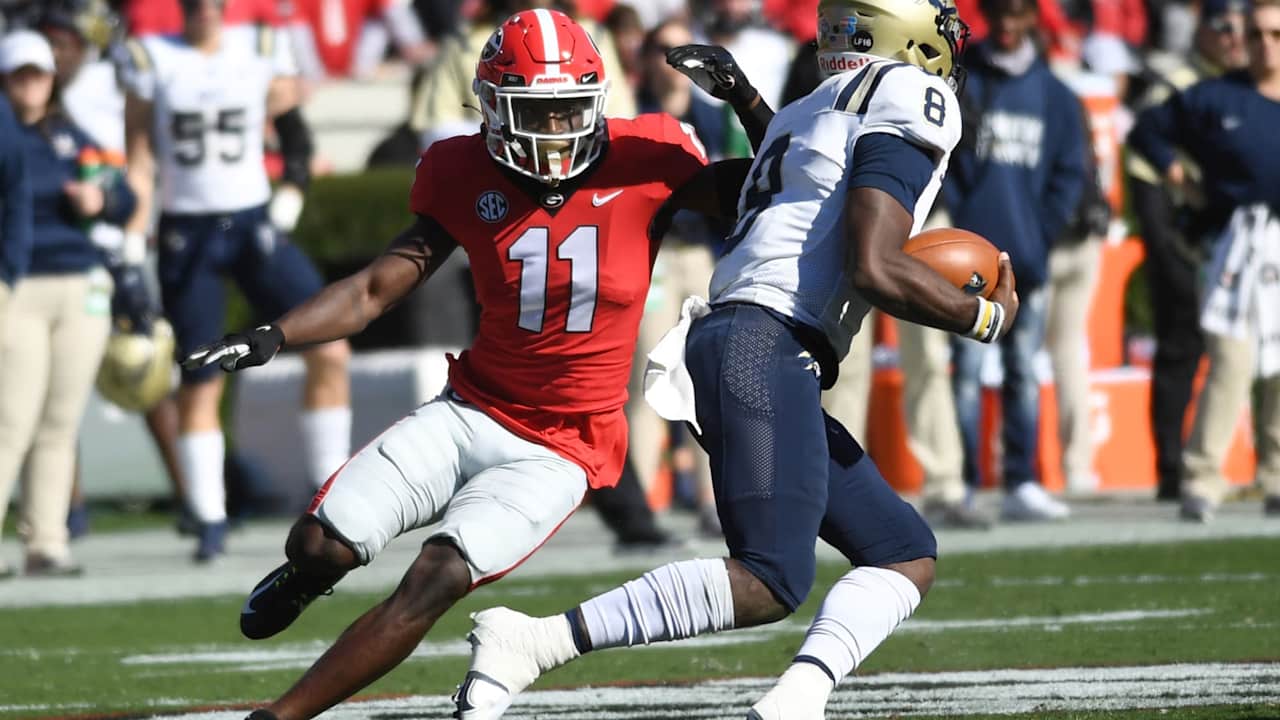 Georgia Bulldogs Defensive Back Derion Kendrick (11) pursues Charleston Southern Buccaneers Quarterback Jack Chambers (8) during the college football game between the Charleston Southern Buccaneers and the Georgia Bulldogs