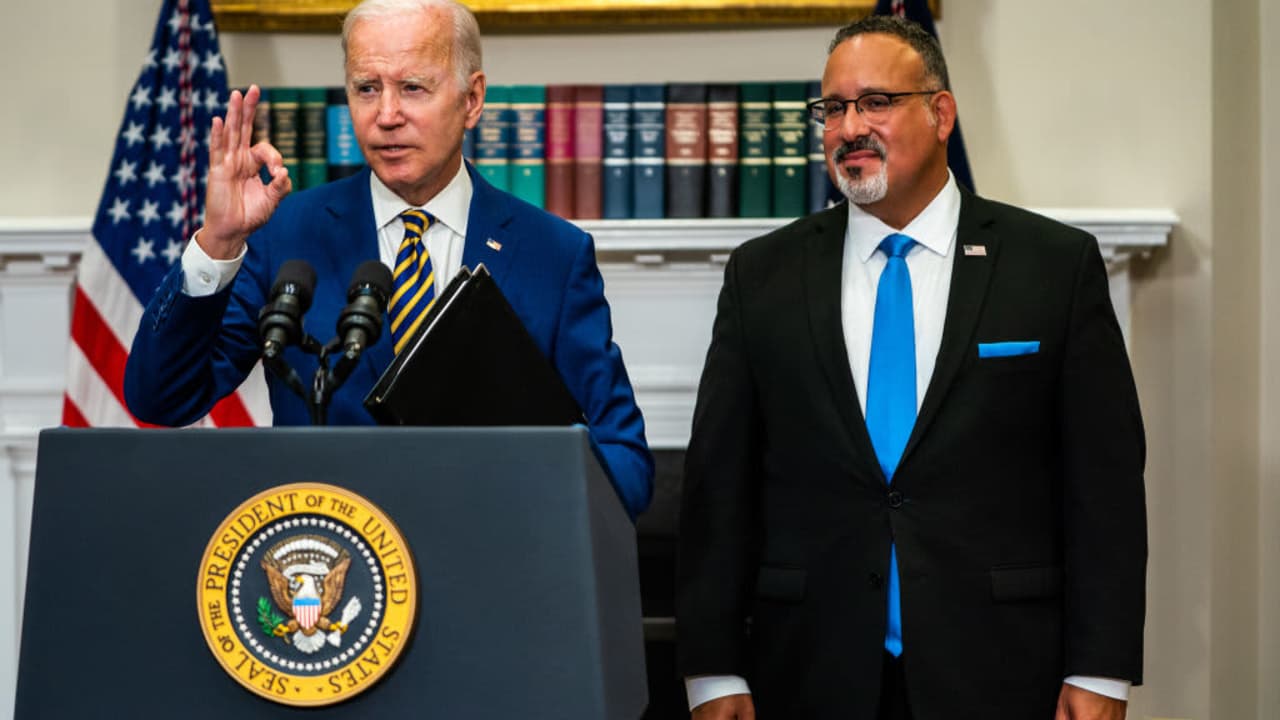 US President Joe Biden delivers remarks regarding student loan debt forgiveness in the Roosevelt Room of the White House on Wednesday August 24, 2022. Education Secretary Miguel Cardona joined.