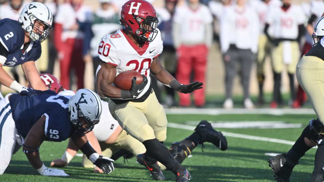 NEW HAVEN, CT - NOVEMBER 20: Harvard Crimson running back Aaron Shampklin (20) rushes down the field during the game as the Harvard Crimson take on the Yale Bulldogs on November 20, 2021, at the Yale Bowl in New Haven, Connecticut. (Photo by Williams Paul/Icon Sportswire via Getty Images)