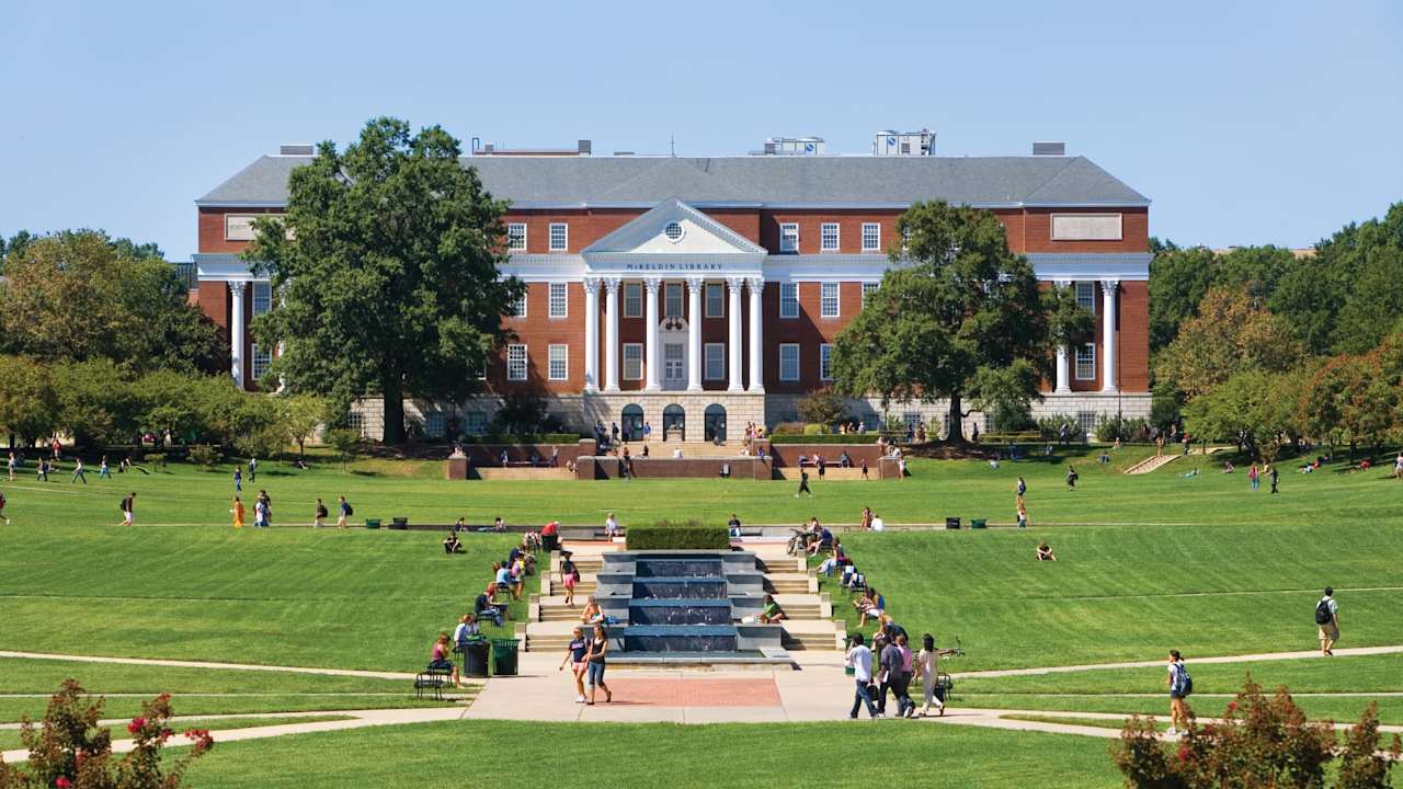 Student walking in McKeldin Mall quadrangle in the heart of the University of Maryland campus in College Park, Maryland.