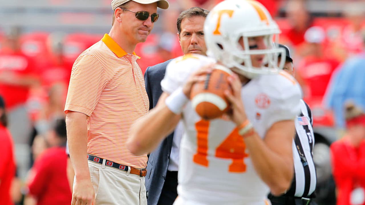 Peyton Manning watching the University of Tennessee quarterback in a game