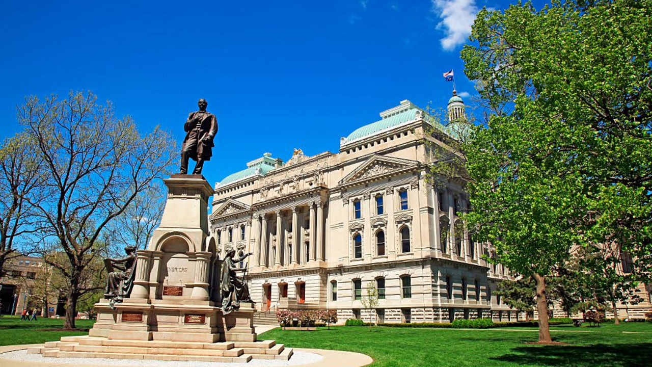 State capitol building in downtown Indianapolis Indiana on a sunny spring morning, Indianapolis is the capital city of Indiana and is located in the center of the state with the capitol building located downtown.