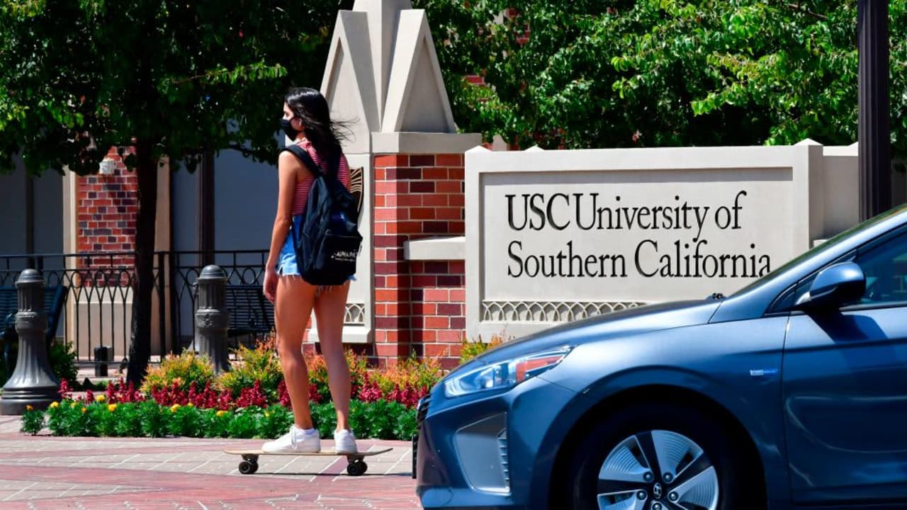 Student skateboarding on USC campus