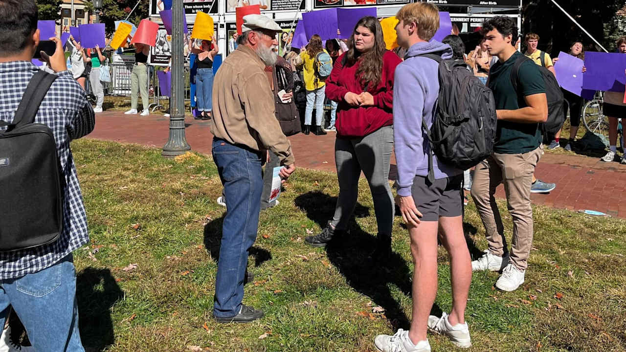 Students gather at McCorkle Place on the University of North Carolina at Chapel Hill to protest a series of graphic anti-abortion billboards displayed on campus.