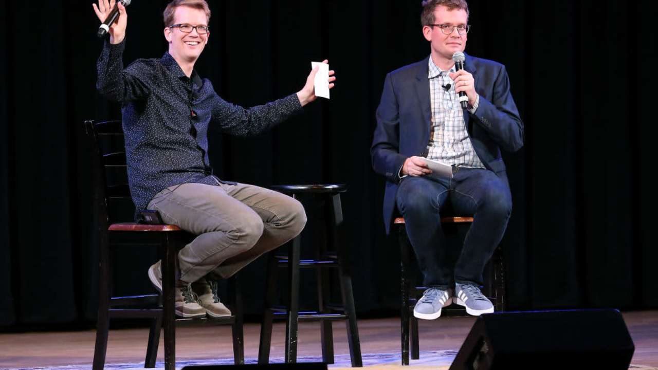 NEW YORK, NY - SEPTEMBER 25: YouTube personality and author Hank Green (L) speaks on stage with his brother, fellow YouTube personality and author John Green, to discuss his new book "An Absolutely Remarkable Thing" at The Town Hall on September 25, 2018 in New York City.