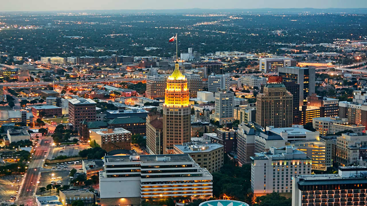 Aerial view of San Antonio illuminated at dusk