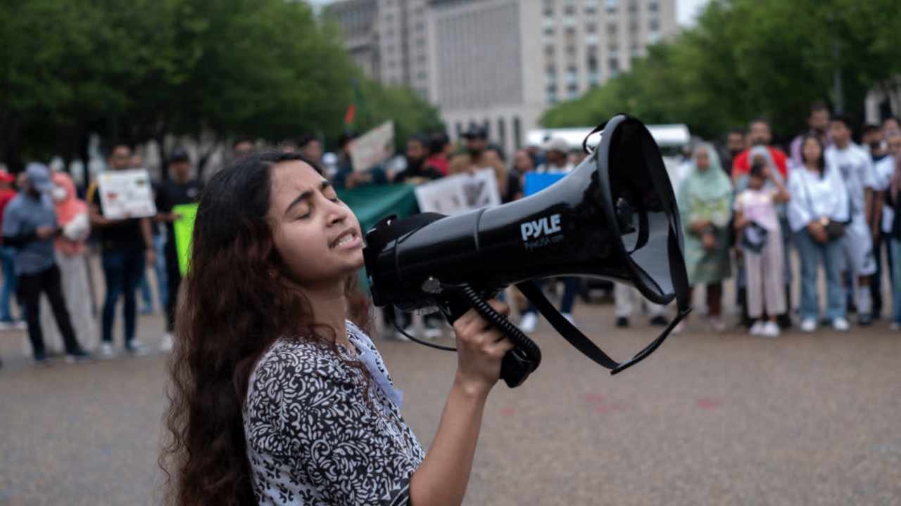 A female Bangladeshi student shouts slogans in front of the White House while joining in a demonstration. Bangladeshi students gathered with banners and Bangladeshi flags in front of the White House on July 20, 2024, as they showed solidarity with Bangladesh students anti-'Quota' protest. More than one hundred people have been killed in the clashes so far across Bangladesh and over 1,500 have been injured by the authoritarian government during a movement demanding reform of the quota system in government jobs.