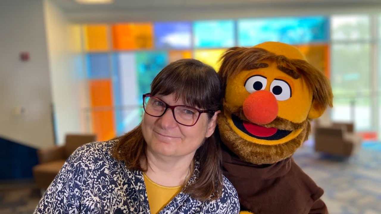 Little Frank, Marian University's Muppet student guide, poses with Sister Mary Beth of the Sisters of St. Francis of Oldenburg, at Marian University in Indianapolis, Indiana.