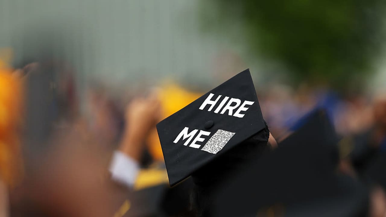 A graduating student's cap declares their future intentions during commencement exercises at City College