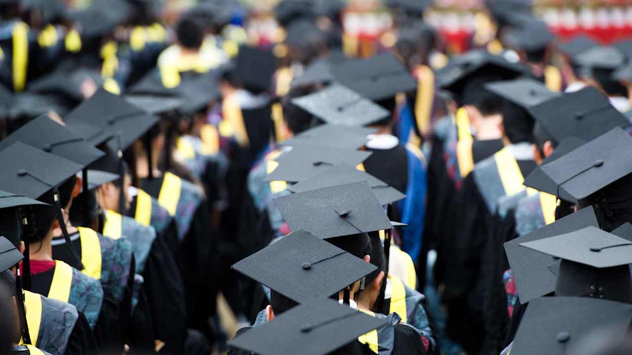 Shot of graduation caps during commencement.