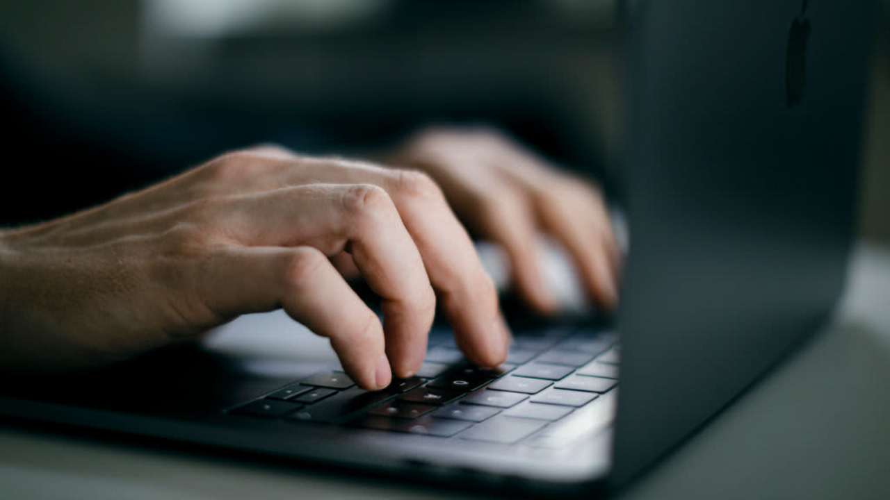 Human hands on a keyboard