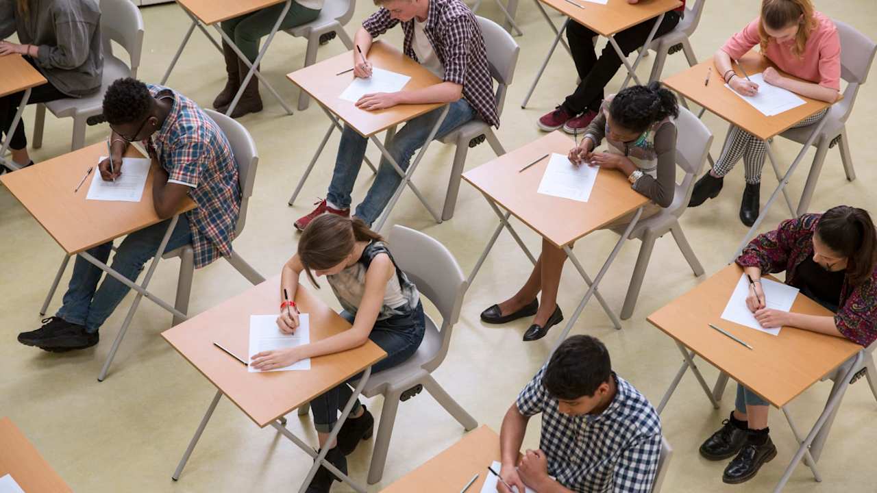 Overhead view of a classroom full of high school students taking the ACT test.