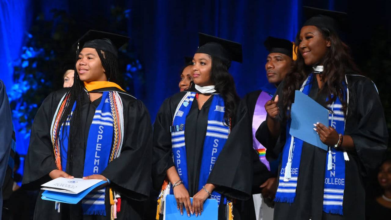 Spelman College graduates onstage during the college's 2023 commencement ceremony at Georgia International Convention Center on May 21, 2023.