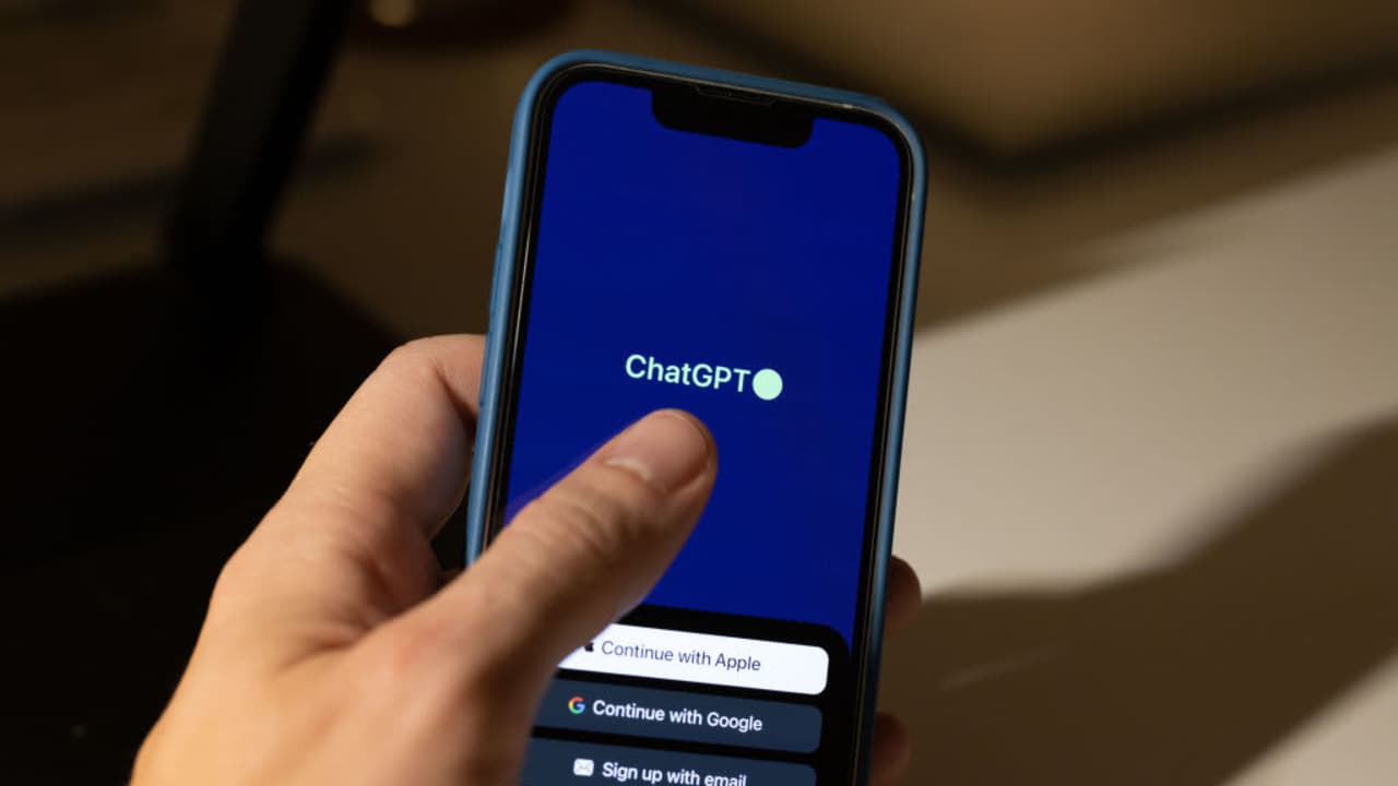 A ChatGPT iOS App logo displayed on a smartphone.
