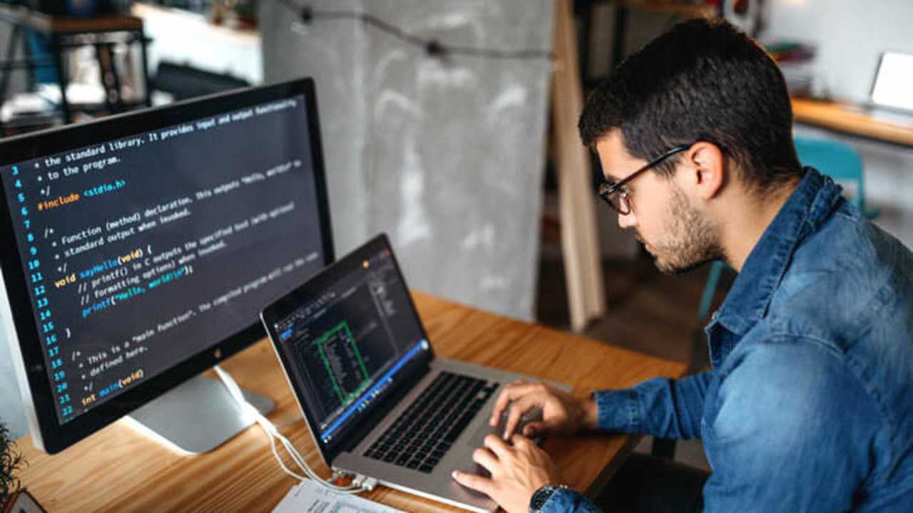 Male programmer coding at home. Image Credit: Creative DJ / E+ / Getty Images