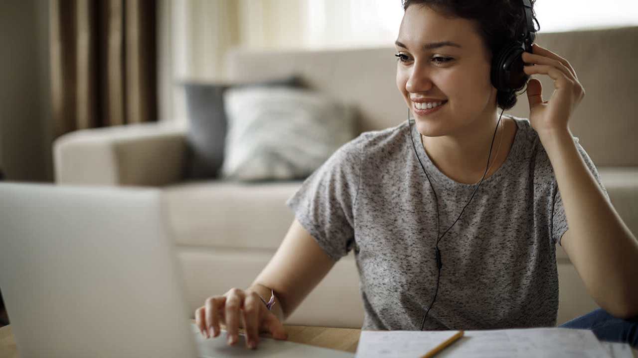 Woman on her laptop smiling
