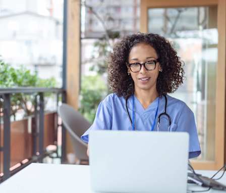 Medical coder on laptop