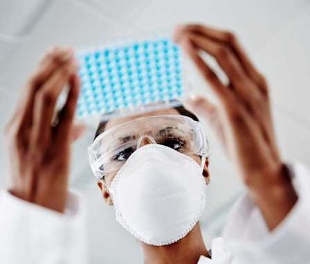 Nurse examining laboratory samples