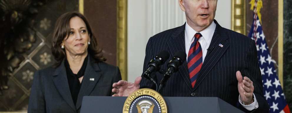 U.S. President Joe Biden speaks before signing H.R. 2471, the "Consolidated Appropriations Act, 2022," with U.S. Vice President Kamala Harris, left, in the Indian Treaty Room of the White House