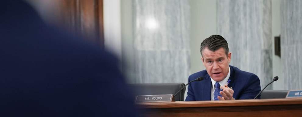 WASHINGTON, DC - JANUARY 21: Senator Todd Young, a Republican from Indiana, speaks as Pete Buttigieg, U.S. secretary of transportation nominee for U.S. President Joe Biden, left, listens during a Senate Commerce, Science and Transportation Committee confirmation hearing on January 21, 2021 in Washington, D.C. Buttigieg, is pledging to carry out the administration’s ambitious agenda to rebuild the nation’s infrastructure, calling it a “generational opportunity” to create new jobs, fight economic inequality and stem climate change.