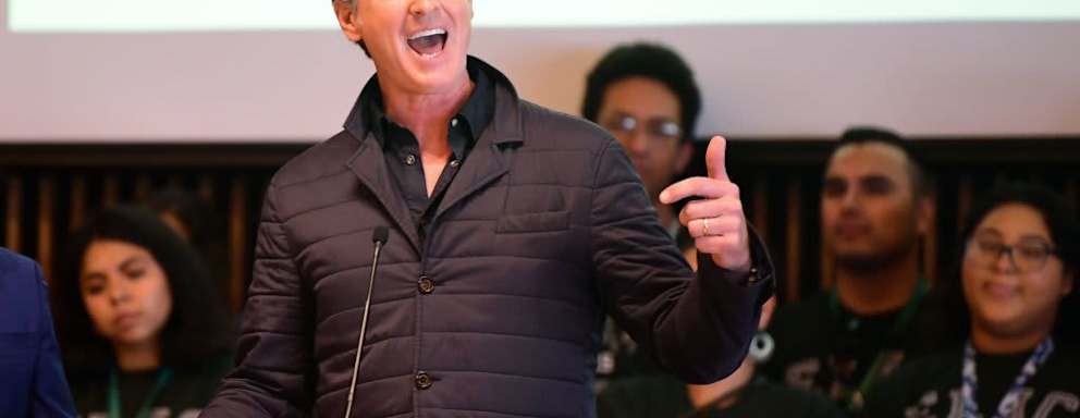 California Governor Gavin Newsom gestures as he speaks on a visit to East Los Angeles College on August 29, 2019 in Monterey Park, California. - Newsom spoke about the California College Promise Program, which will provide two free years of community college to any first-time, full-time California student.
