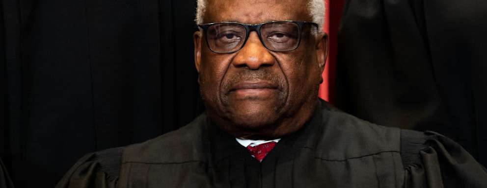 WASHINGTON, DC - APRIL 23: Associate Justice Clarence Thomas sits during a group photo of the Justices at the Supreme Court in Washington, DC on April 23, 2021.