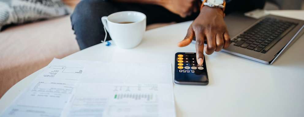 Unrecognisable man going over his finances