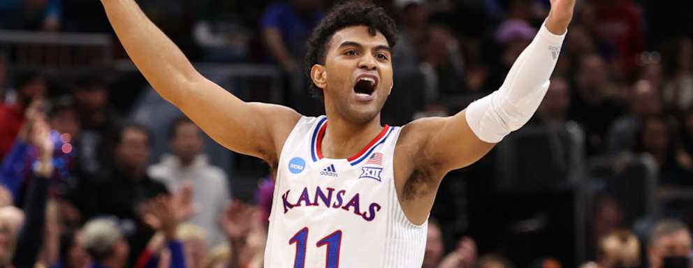 Remy Martin #11 of the Kansas Jayhawks reacts against the Miami (Fl) Hurricanes during the Elite Eight round of the 2022 NCAA Mens Basketball Tournament