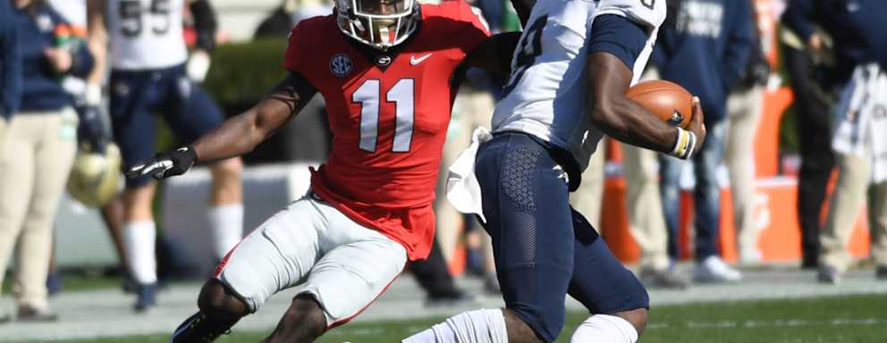 Georgia Bulldogs Defensive Back Derion Kendrick (11) pursues Charleston Southern Buccaneers Quarterback Jack Chambers (8) during the college football game between the Charleston Southern Buccaneers and the Georgia Bulldogs