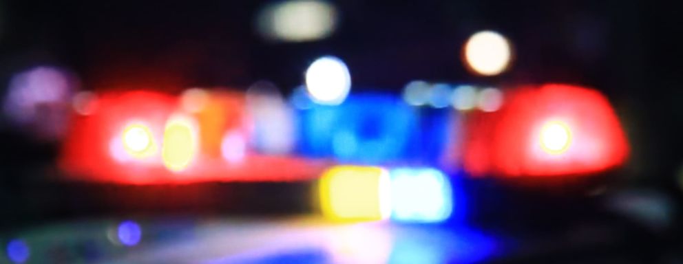 police car headlights in a blurry focus.