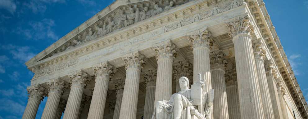 The Guardian or Authority of Law sculpture on the side of the U.S. Supreme Court building in Washington, DC.