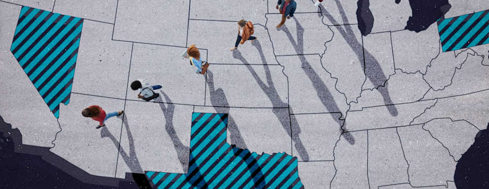 Group of young adults, photographed from above, on top of a map of the United States