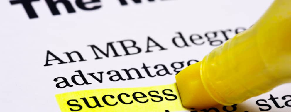 Under the heading 'The MBA' in a printed document, the word 'success' is highlighted in yellow.