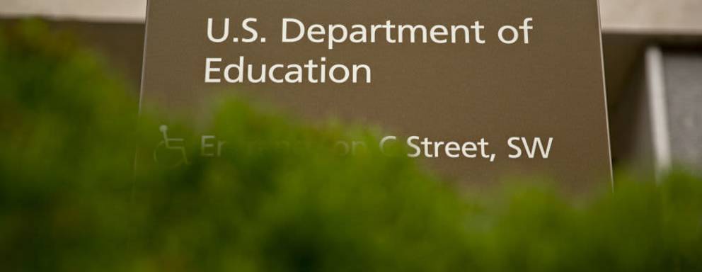 Exterior entrance sign leading to the U.S. Department of Education headquarters in Washington, DC.