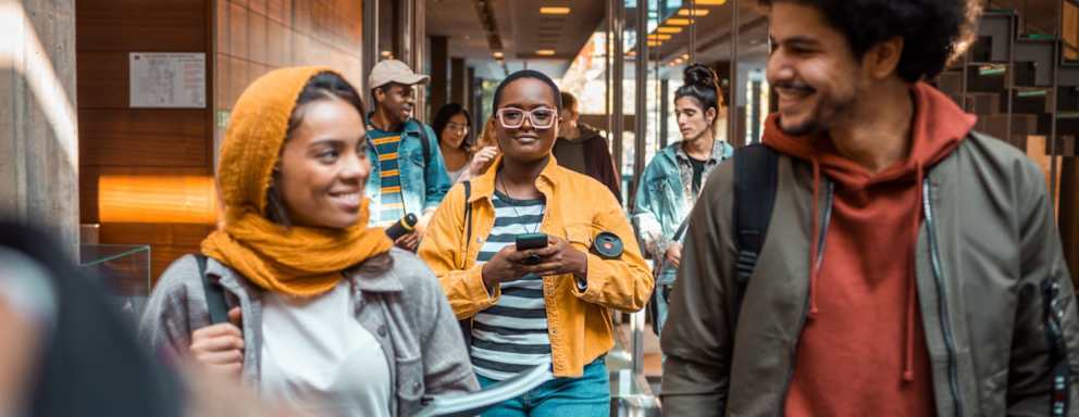 Close up of a group of college students entering the university
