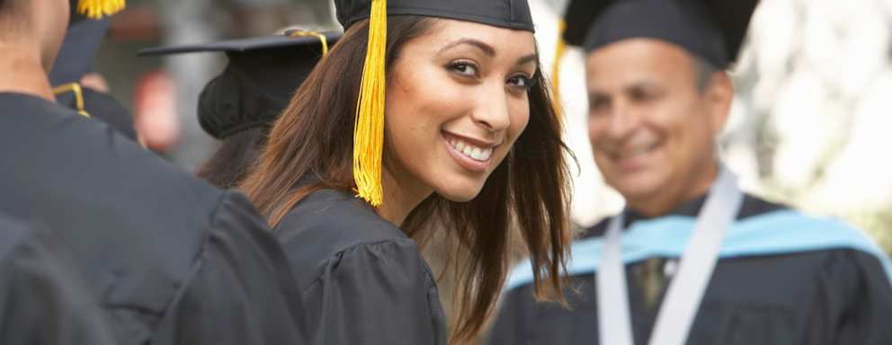 Female graduate student at graduation ceremony, portrait