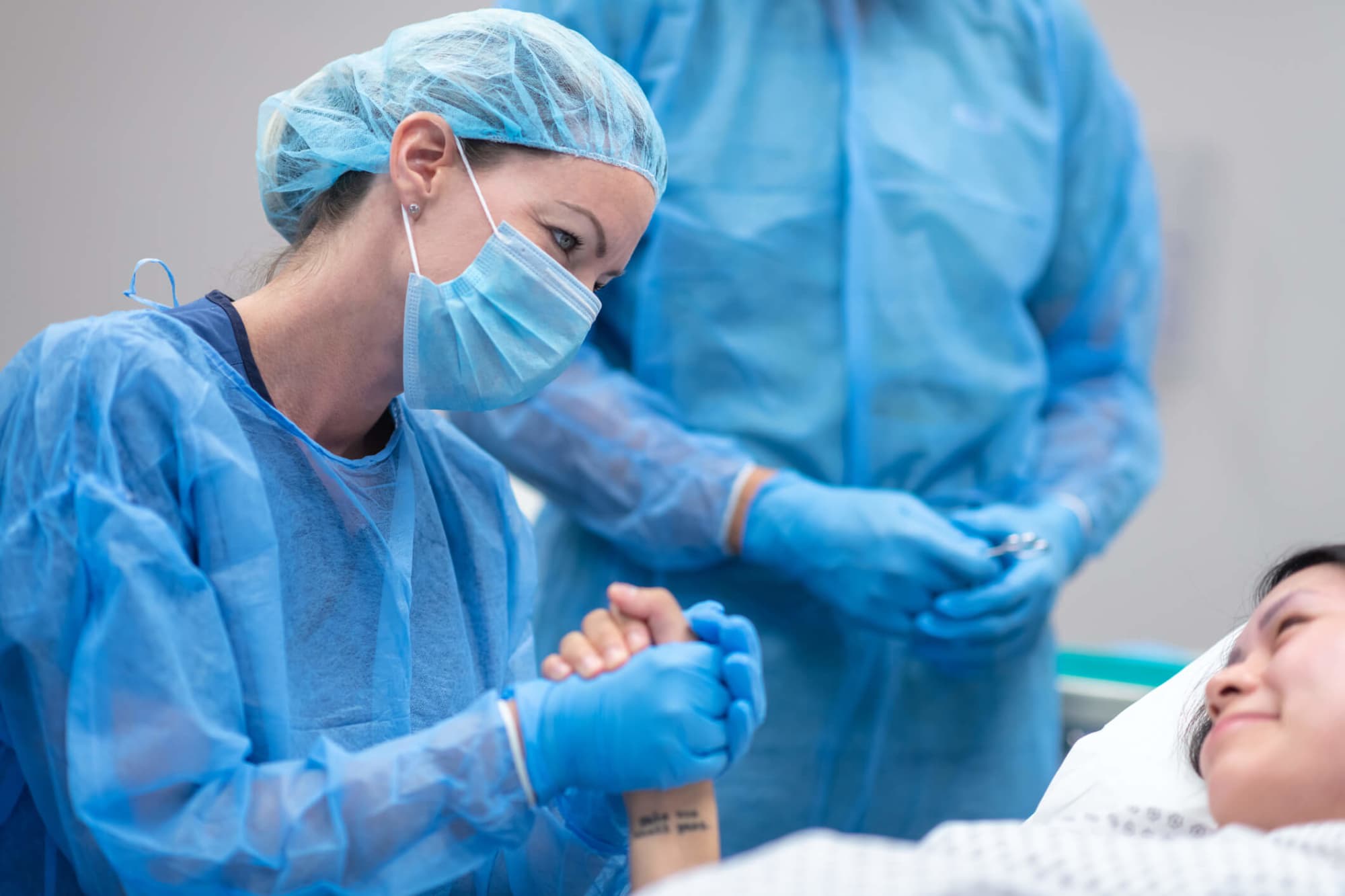 Midwife comforting patient