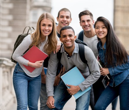 Group of college students outside smiling