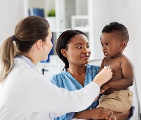 African American boy with doctor