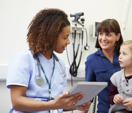 FNP helping mom and daughter in doctor's office