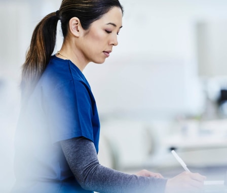 Female nursing student taking notes