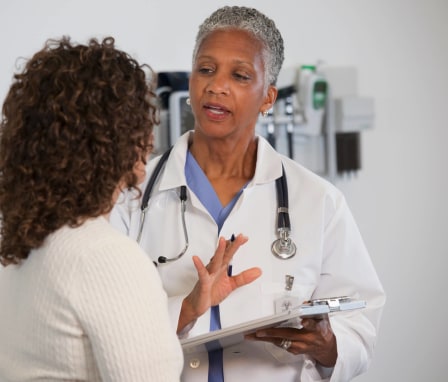 Nurse giving instructions to patient